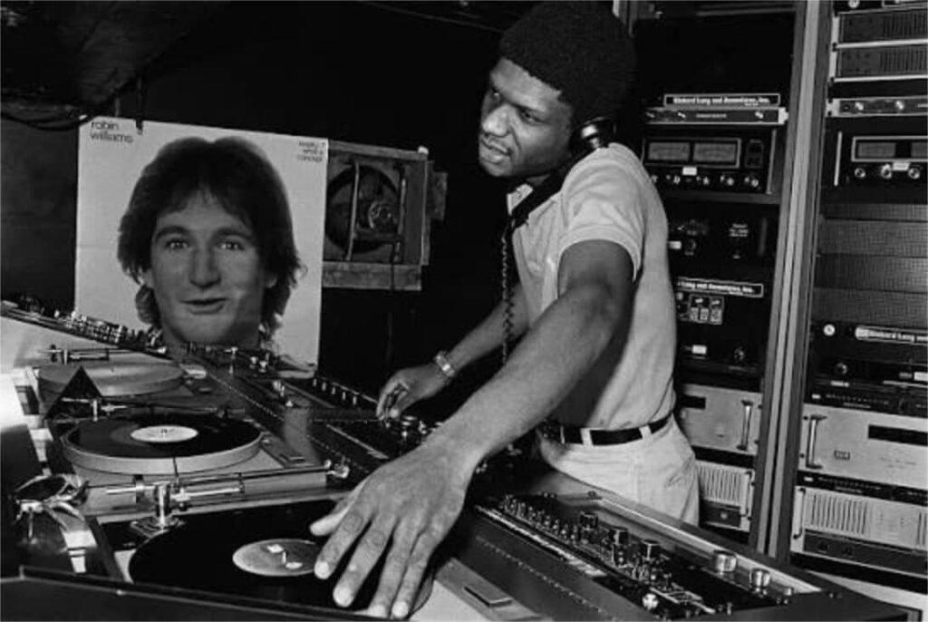 Larry Levan working the dj booth at Paradise Garage in 1979.
